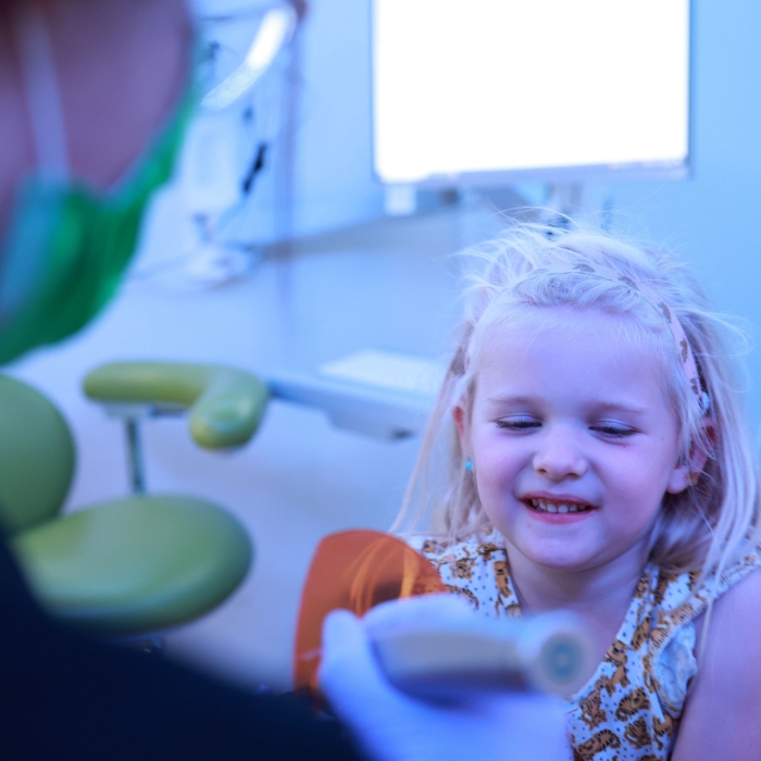 Young girl smiling in the dental chair