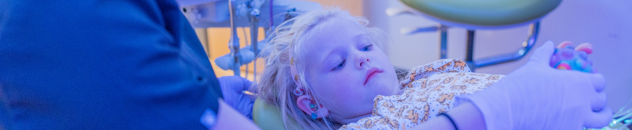 Young girl visiting her pediatric dentist in Denver