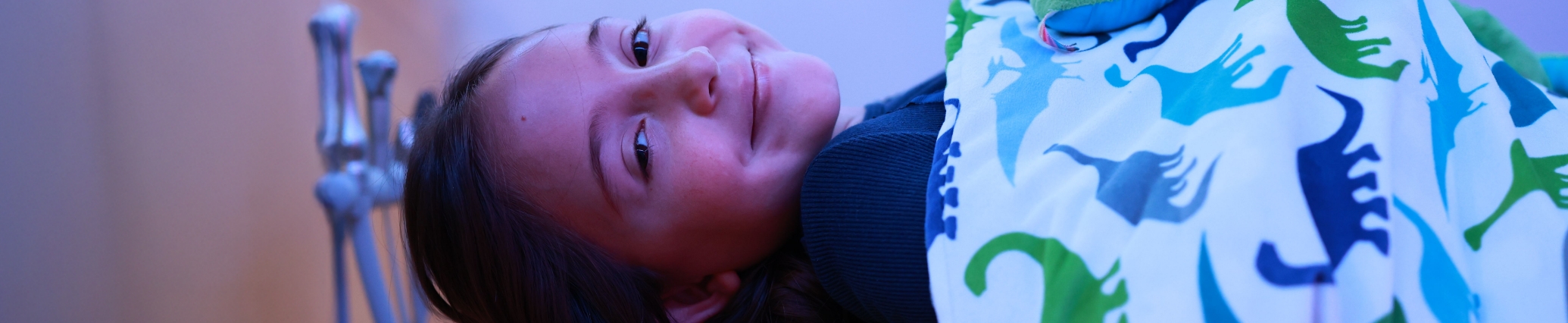 Young girl smiling after receiving pediatric dental services in Denver