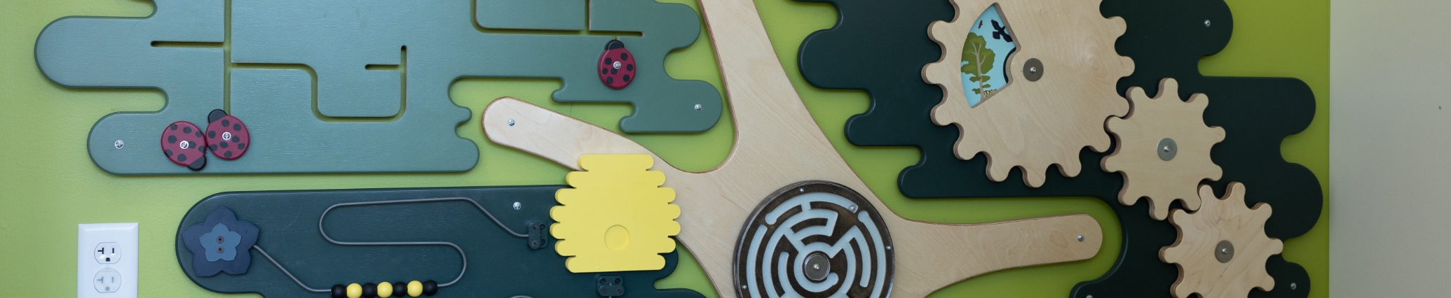 Close up of a puzzle on a wall of a pediatric dental office in Denver