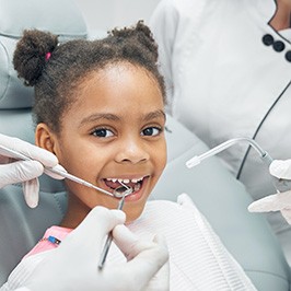 smiling child during dental work