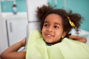 smiling, relaxed little girl after dental treatment